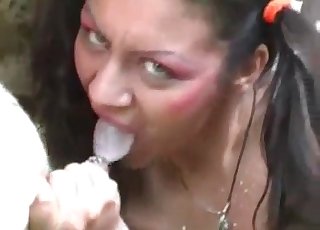 Pigtailed brunette blows a sexy beast