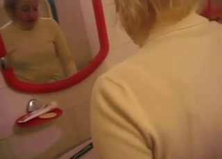 Mature lady with a hot pussy sucks off a dog