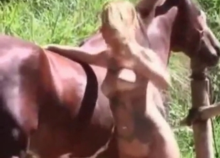 Incredible blonde slut really loves having sex with a brown stallion
