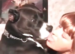 Naked whore is having some fun with a lovely black dog