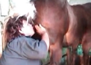 Filthy woman giving a rim job to a handsome horse