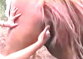 Lovely zoophile is stimulating the asshole of this animal