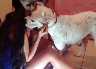 Dress-wearing zoophile licked by a dog