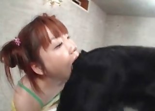 Redheaded Japanese girl eats dog ass
